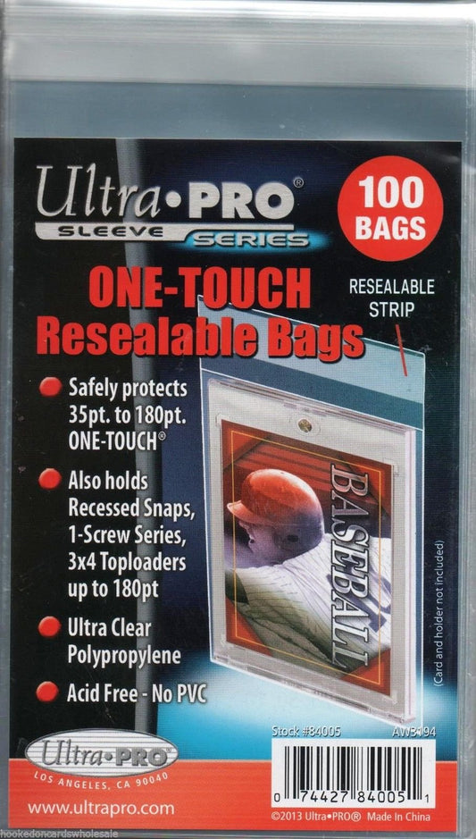 A magnetic One Touch holder being placed inside a clear, resealable Ultra Pro protective bag.