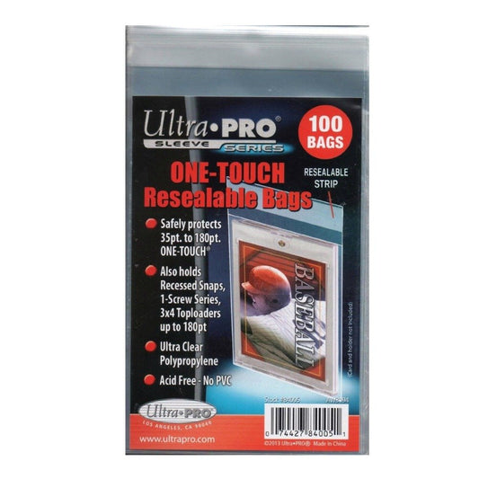 A magnetic One Touch holder being placed inside a clear, resealable Ultra Pro protective bag.